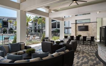 Outdoor kitchen with lounge, fire pit & tvs